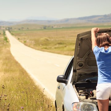 features extended car warranty services warranty direct woman with car on country road car breakdown open hood